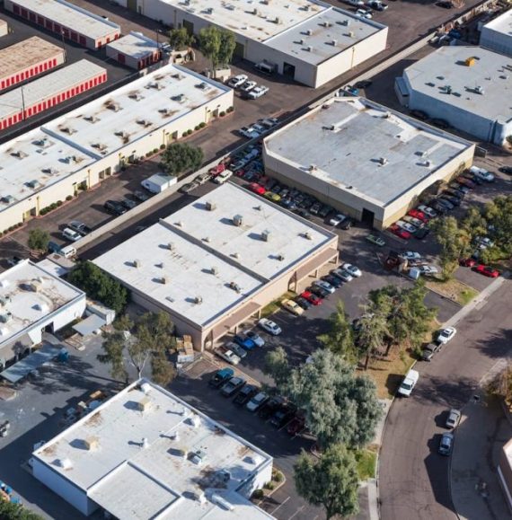 An areal photograph of a factory and surrounding office buildings.